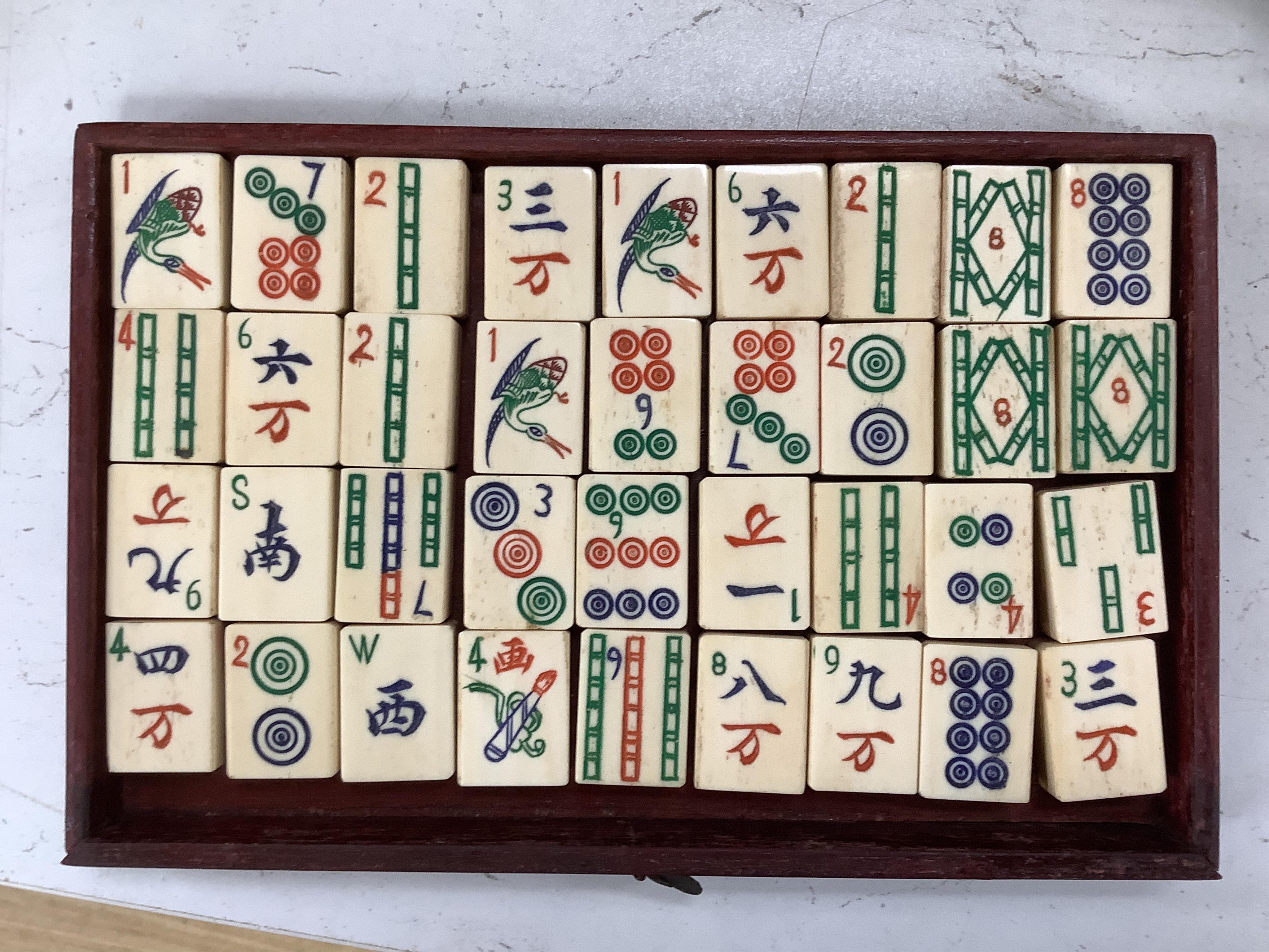 An early 20th century Chinese cased mah jong set, 20cm wide x 17cm high